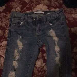 Ripped, blue jeans. Size three in women